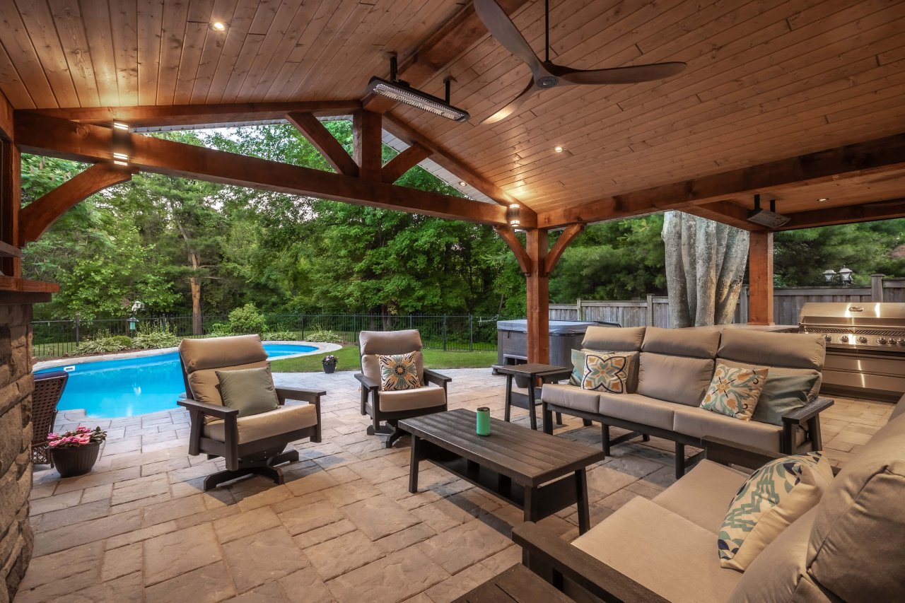Back yard resort with pool and lounge seating.